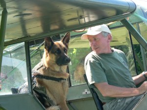 Pharaoh riding the back of the Piper Super Cub