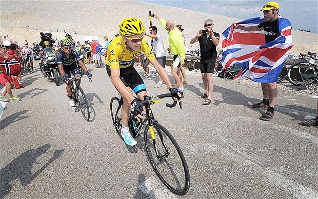 Heading for glory: Chris Froome is cheered on by a British fan Photo: PA