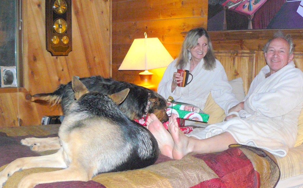 Cleo, foreground, and Sweeny helping open presents!