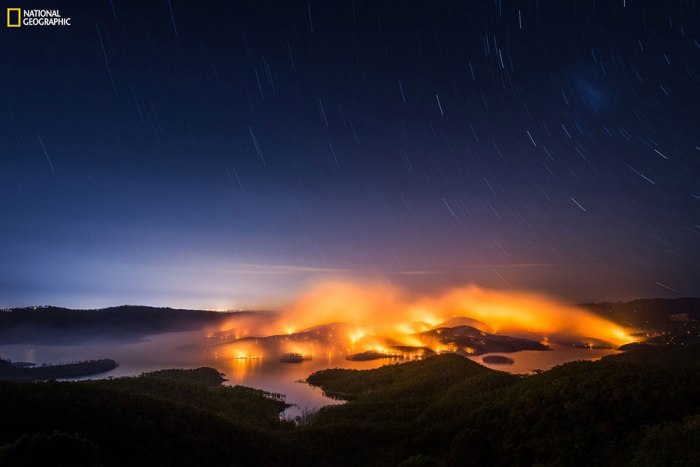 "I headed out one night to photograph the Milky Way. As I reached the top of the mountain, this magnificent scene presented itself to me. I immediately wanted to photograph it in all its glory. After trying out a few different exposure times, I settled on duration of roughly 16 minutes. This allowed me to capture the intense glow of the fire along with the surreal star trails seen in the sky." Location: Advancetown Lake, Gold Coast Hinterland, Australia. Photo by Dave Kan.