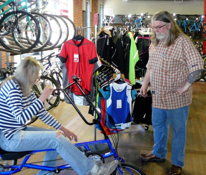 Eric at the store checking that the bike was properly set up for Jean.