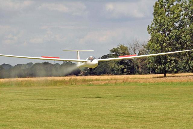 Modern fibreglass glider coming into land at Rattlesden G.C.