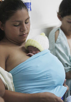  A young mother participates in a ‘Kangaroo Mother’ program at the National Maternity Hospital in El Salvador. Luis Galdamez/Reuters 